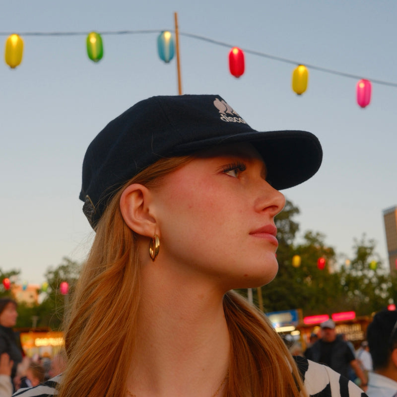 black cap under the lanterns
