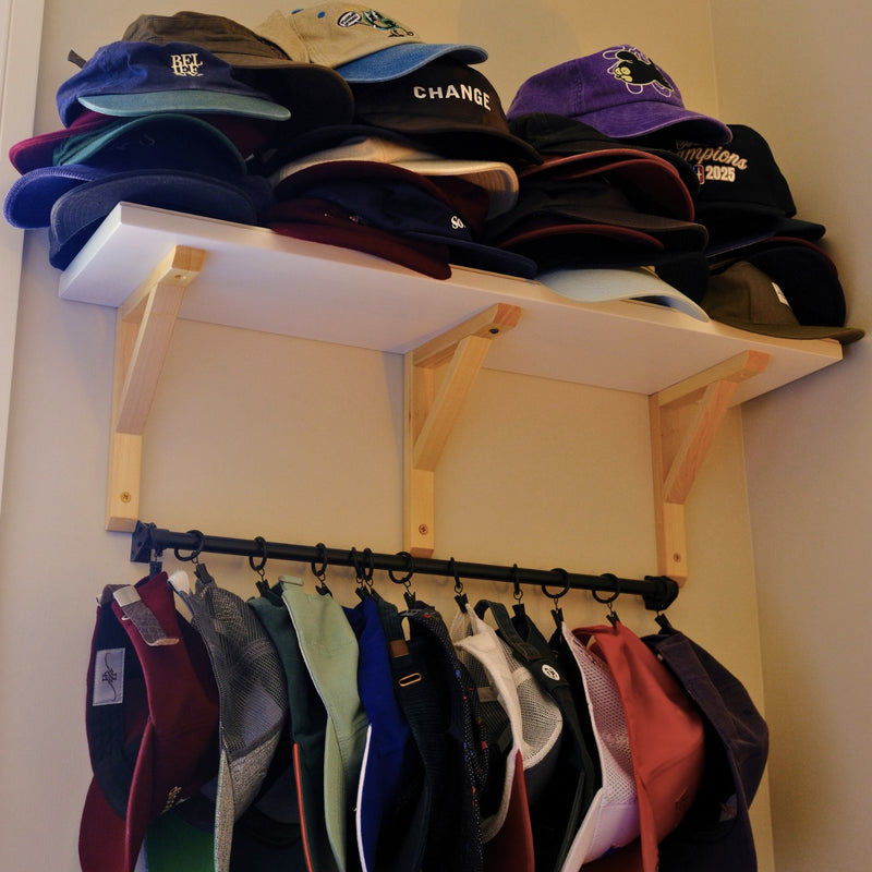 caps on the shelf and the rail